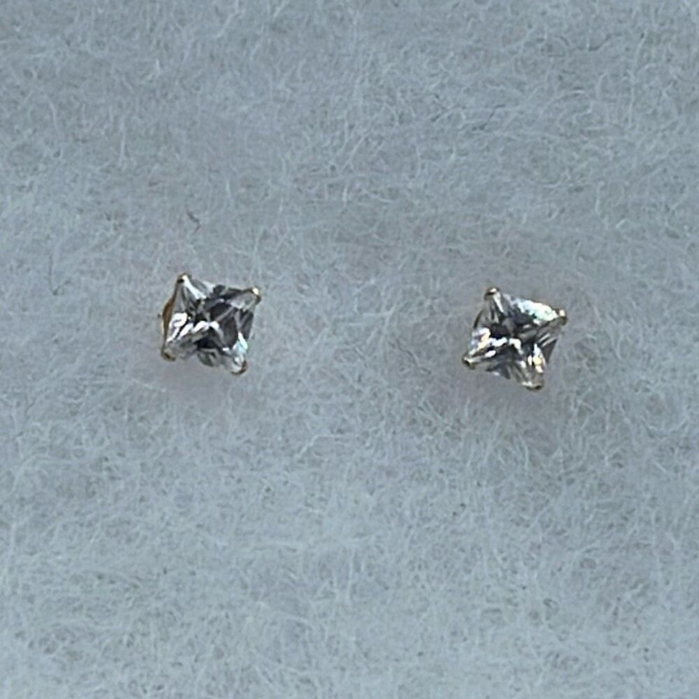 14K JCM CZ stud earrings.